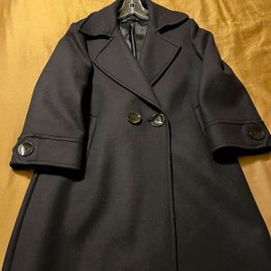 Knee length beautiful navy color and 75% wool